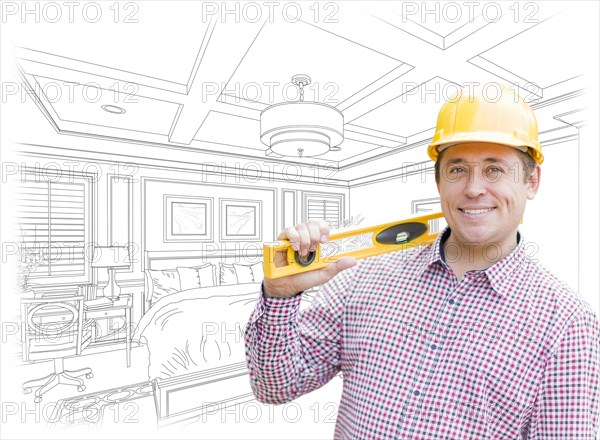 Smiling contractor in hard hat with level over custom bedroom drawing and photo combination