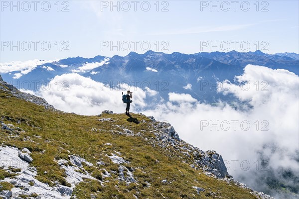 Hikers above the clouds