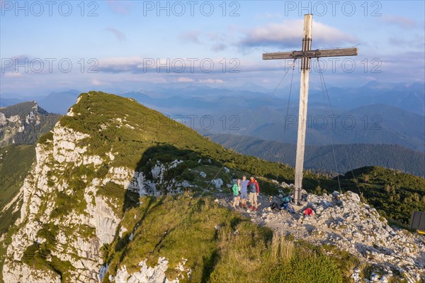 Three hikers at the summit