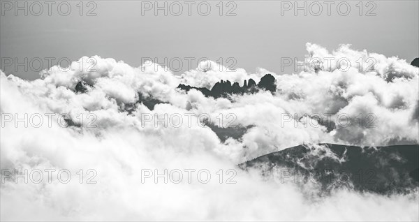 Clouds hanging between mountain peaks