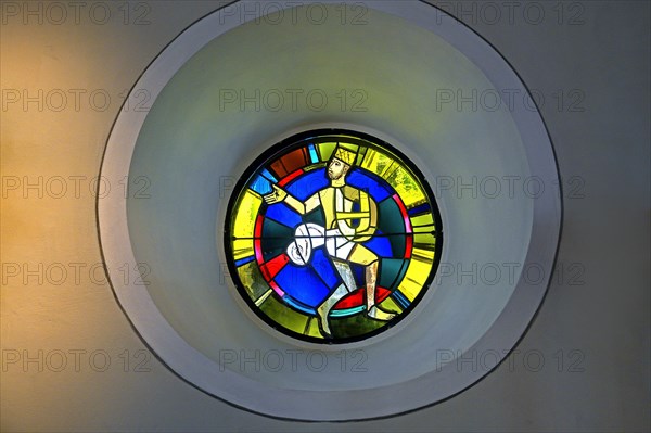 Modern church window with a figure