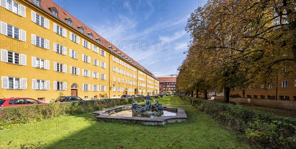 Inner courtyard with park and yellow apartment buildings