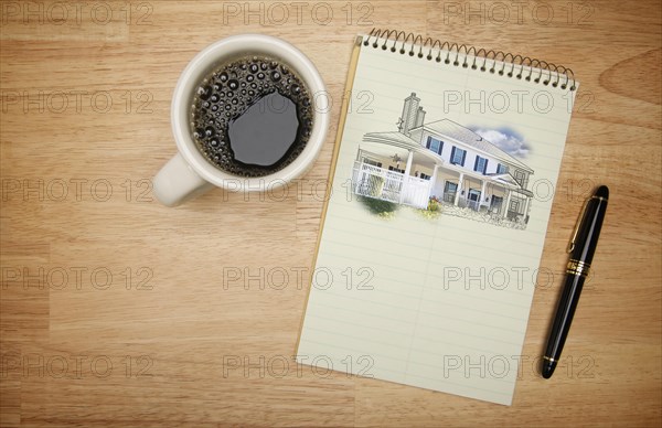 Pad of paper with house drawing