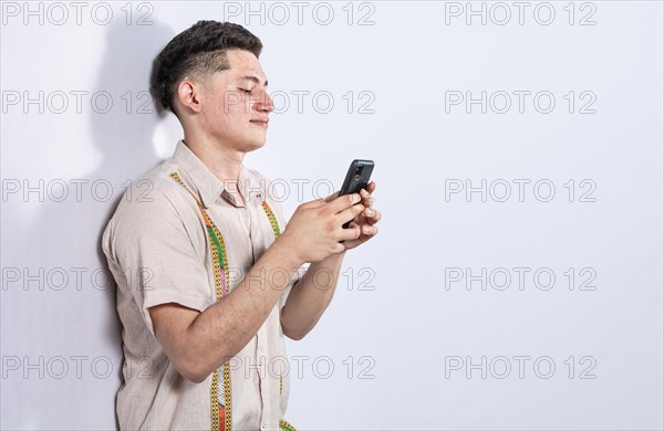 Handsome guy happy with his cell phone on isolated backgrounds