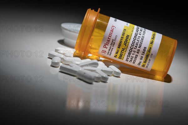 Hydrocodone pills and prescription bottle with non proprietary label. no model release required