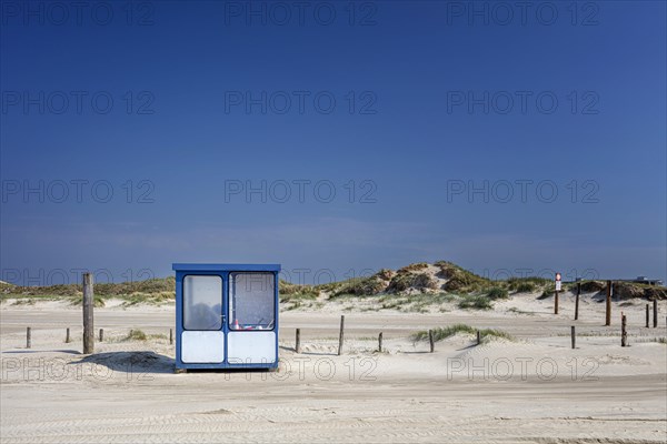 Beach with wooden planks and guard house