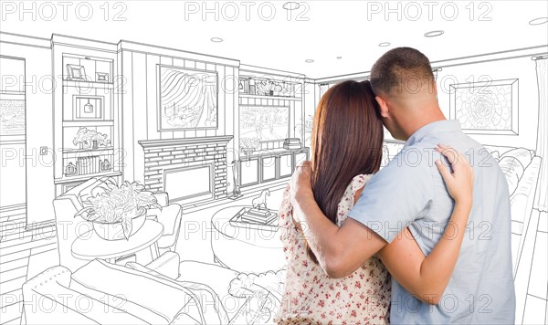 Curious young military couple looking over custom living room design drawing