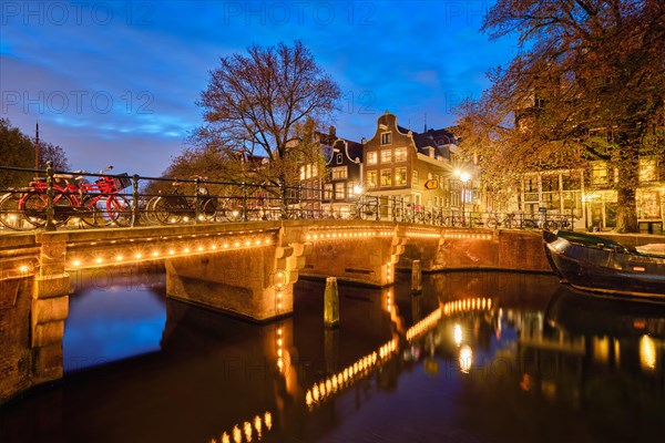 Night view of Amterdam cityscape with canal