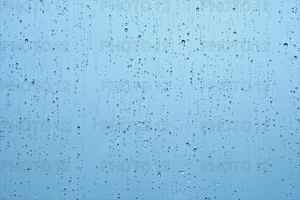 Rain water drops droplets on window glass texture background
