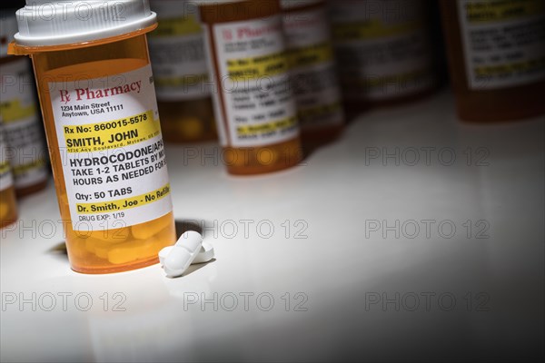 Hydrocodone pills and prescription bottles with non proprietary label. no model release required