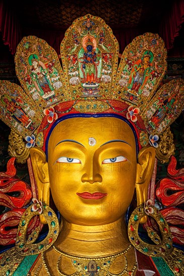 Maitreya Buddha statue face close up in Thiksey Gompa. Ladakh