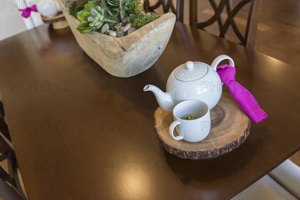 Beautiful abstract of inviting table setting with tea and kettle