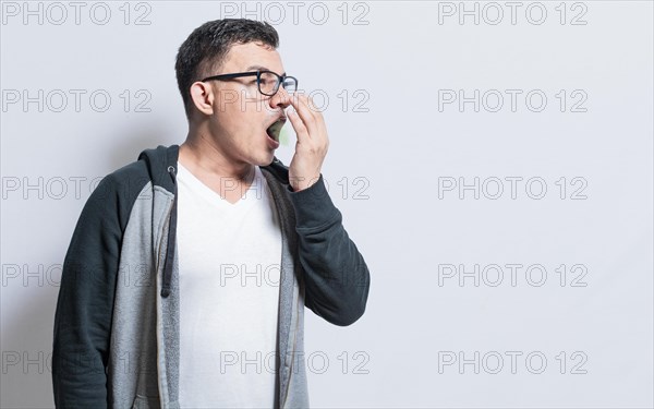 Handsome man with bad breath and halitosis problem