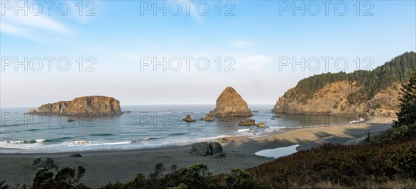 Beach and rocks in the sea in the morning light