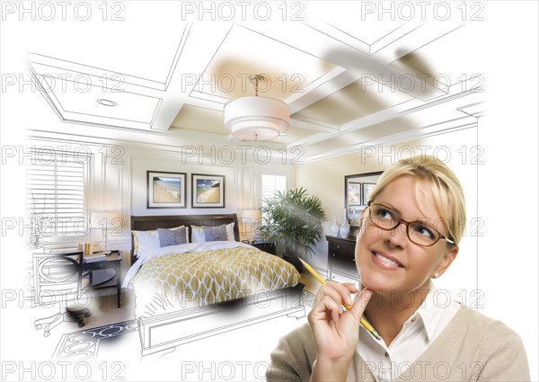 Daydreaming creative woman with pencil over custom bedroom design drawing and photo combination