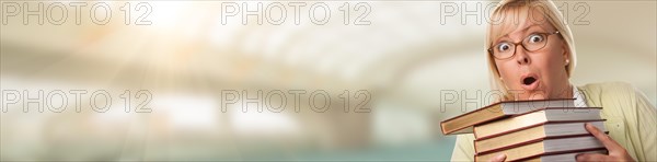 Banner of beautiful expressive student or businesswoman with books