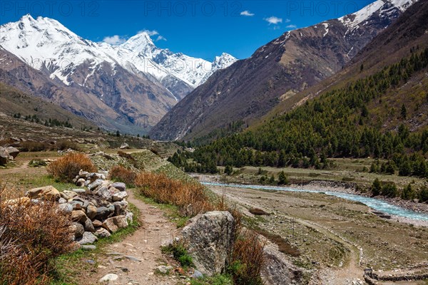 Old trade route in Himalaya surrounded with stones to Tibet from Chitkul village from Sangla Valley