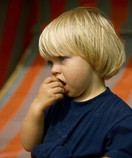 Little girl eating rusks Photo: