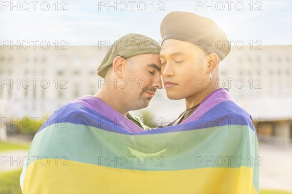 Couple of gay men in love embracing each other