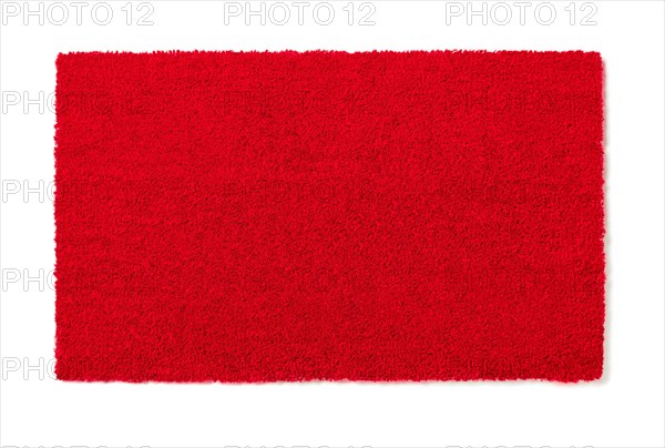 Blank red welcome mat isolated on white background ready for your own text