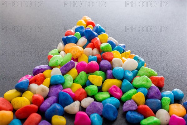 Pile of little colorful pebbles as stone background