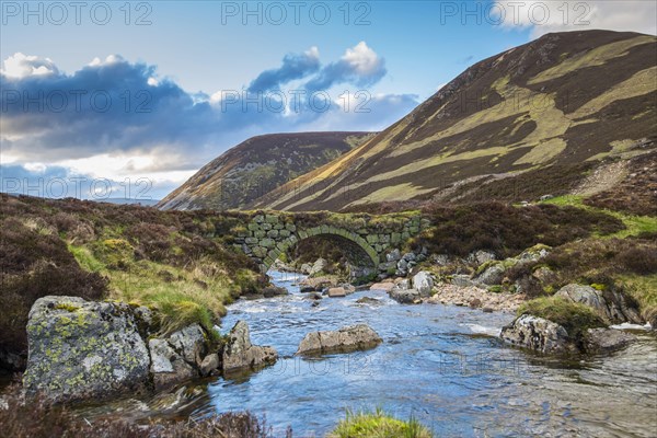 View of the stone bridge over the river in Glen