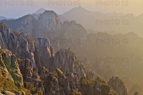 View of mountain range with granite peaks at sunrise