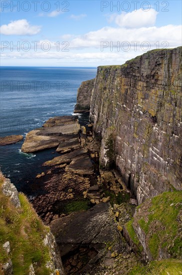 View of Torridonian red sandstone sea cliffs in northwest of island