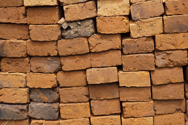 Sun-dried bricks stacked and ready for use