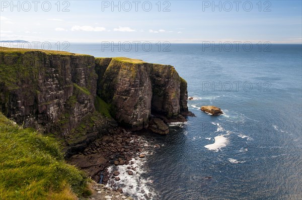 View of Torridonian red sandstone sea cliffs in northwest of island