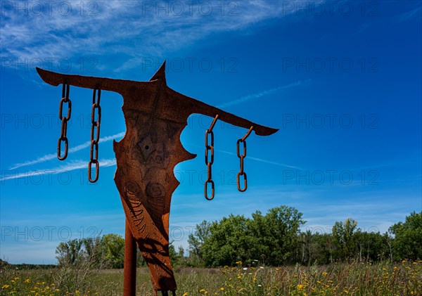 Depiction of a rusty scarecrow on the Ferropolis art trail in Graefenhainichen