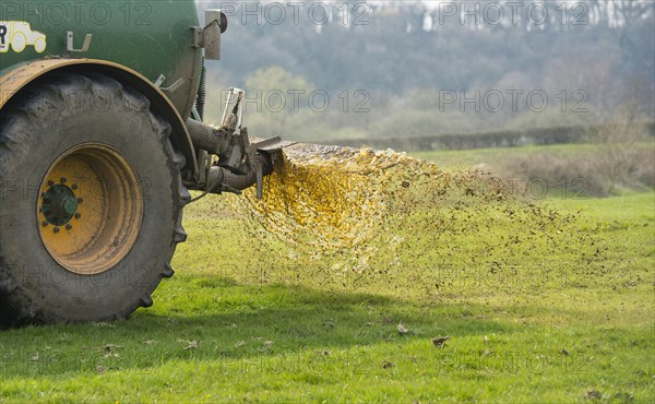 Slurry tanker spreading manure on grassland near Longridge