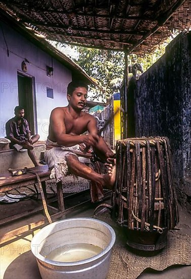 Making of Jendai or leather music instrument in Peruvemba