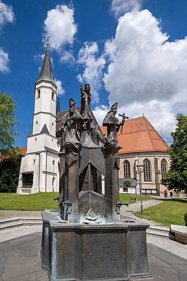 Fountain in front of the collegiate parish church of St. Philip and St. James in the pilgrimage town of Altoetting. The fountain was erected to mark the 1250th anniversary of the establishment of the ...