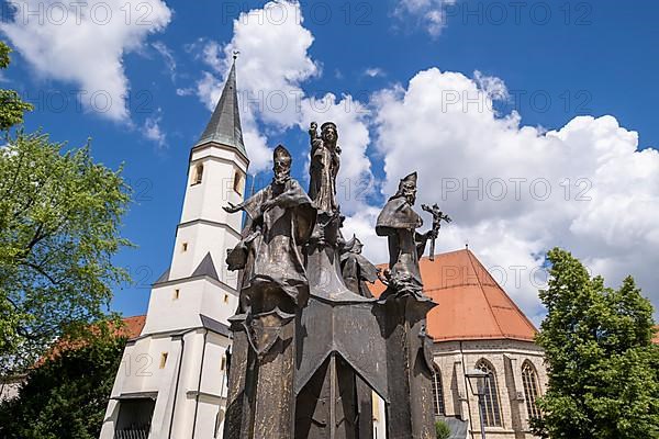 Fountain in front of the collegiate parish church of St. Philip and St. James in the pilgrimage town of Altoetting. The fountain was erected to mark the 1250th anniversary of the establishment of the ...