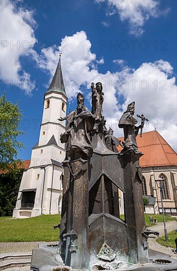 Fountain in front of the collegiate parish church of St. Philip and St. James in the pilgrimage town of Altoetting. The fountain was erected to mark the 1250th anniversary of the establishment of the ...