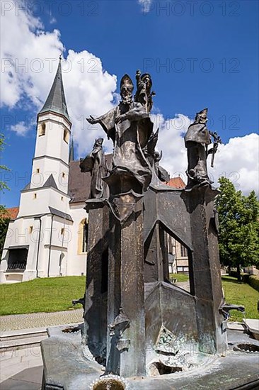 Fountain in front of the collegiate parish church of St. Philip and St. James in the pilgrimage town of Altoetting