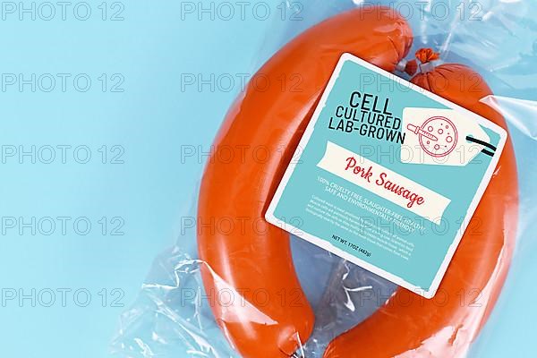 Lab grown cell cultured meat concept for artificial meat showing packed pork sausages with made up label,