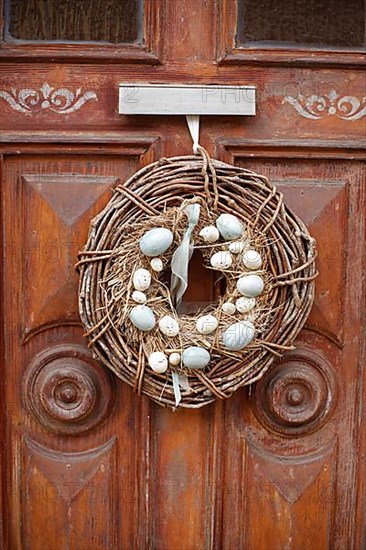 Wreath with Easter eggs on an old house door, Old Town