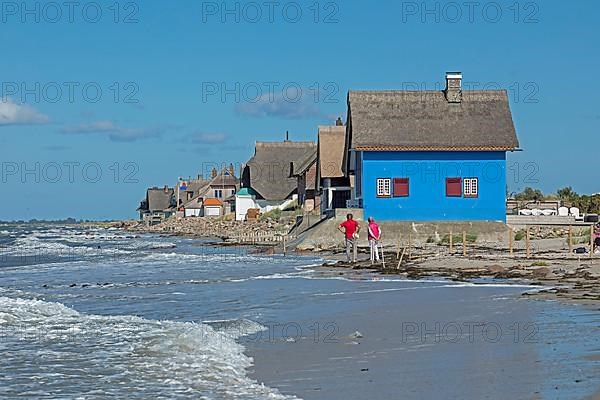 Thatched roof houses on the beach, Graswarder peninsula