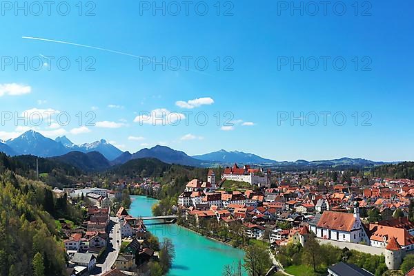 Aerial view of Fuessen with a view of the Lech river, the Benedictine monastery of St. Mang and the high castle. Ostallgaeu Swabia