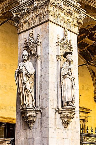Stone figures on a support in the historic centre, Siena