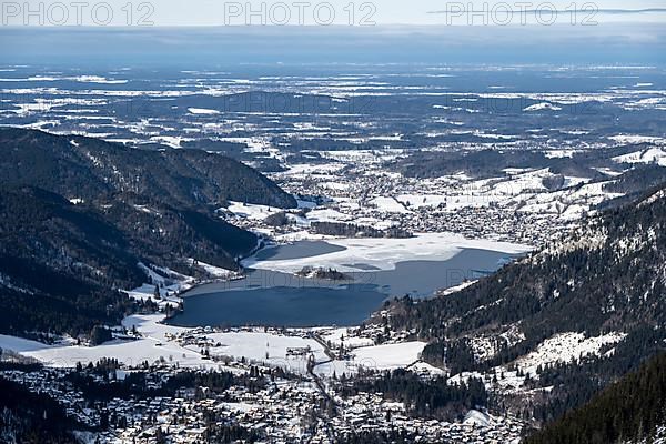 View from the top of the Jagerkamp to Schliersee and village, mountains in winter
