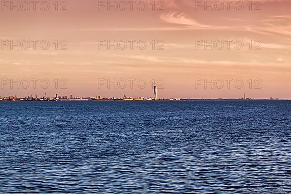 View over the Oeresund to the skyline of Malmoe, Turning Torso skyscraper on the horizon