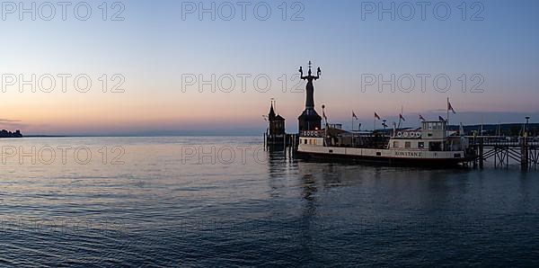 Morning light in the harbour of Constance with Imperia and and the historic ferry Constance, Constance