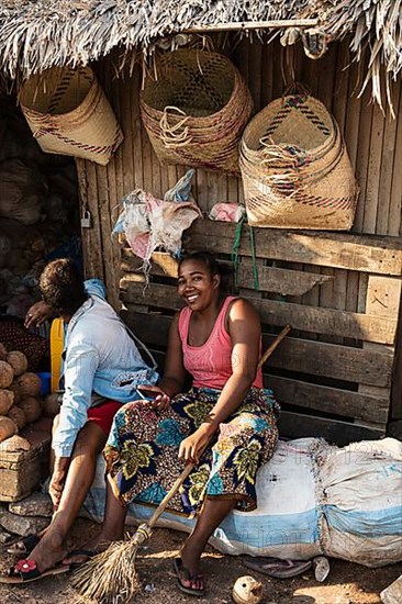 Two market woman, raffia baskets
