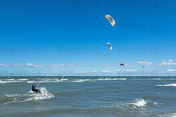 Kitesurfer in front of Graswarder peninsula, Heiligenhafen