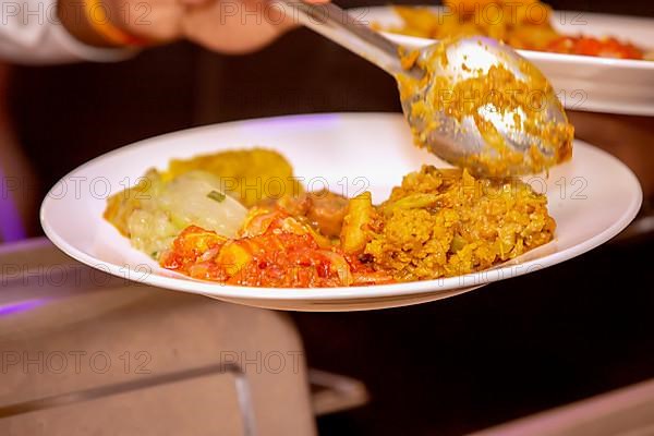 Serving freshly homemade curry of pumpkin