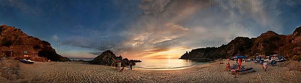 Panorama on the sandy beach and bay Capo Vaticano at sunset