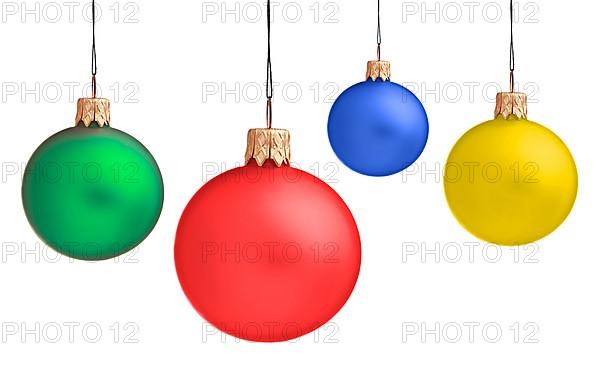 Several hanging Christmas baubles isolated on white background